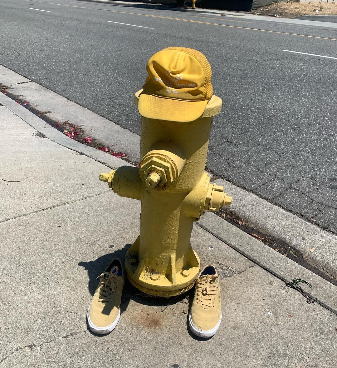 Tom's yellow trucker hat